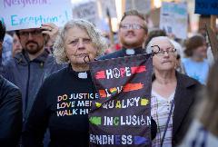The Rev. Roberta Jantzi Egli, a United Methodist clergywoman, participates in a No Kings demonstration in Eugene, Oregon (USA) on October 18, 2025.