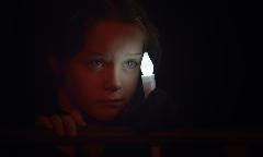 A girl participates in a candlelight vigil during the 20th International AIDS Conference in Melbourne, Australia, July 22, 2014.