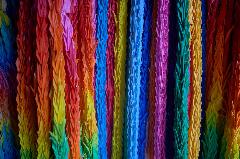 Folded paper cranes hung at an entrance to the Itokazu Abuchiragama cave in Okinawa, Japan. During the Battle of Okinawa, the cave sheltered both Japanese soldiers and civilians. Folded paper cranes are a symbol of peace in Japan.